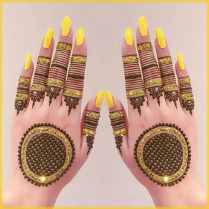 yellow glitter mehndi design for bride