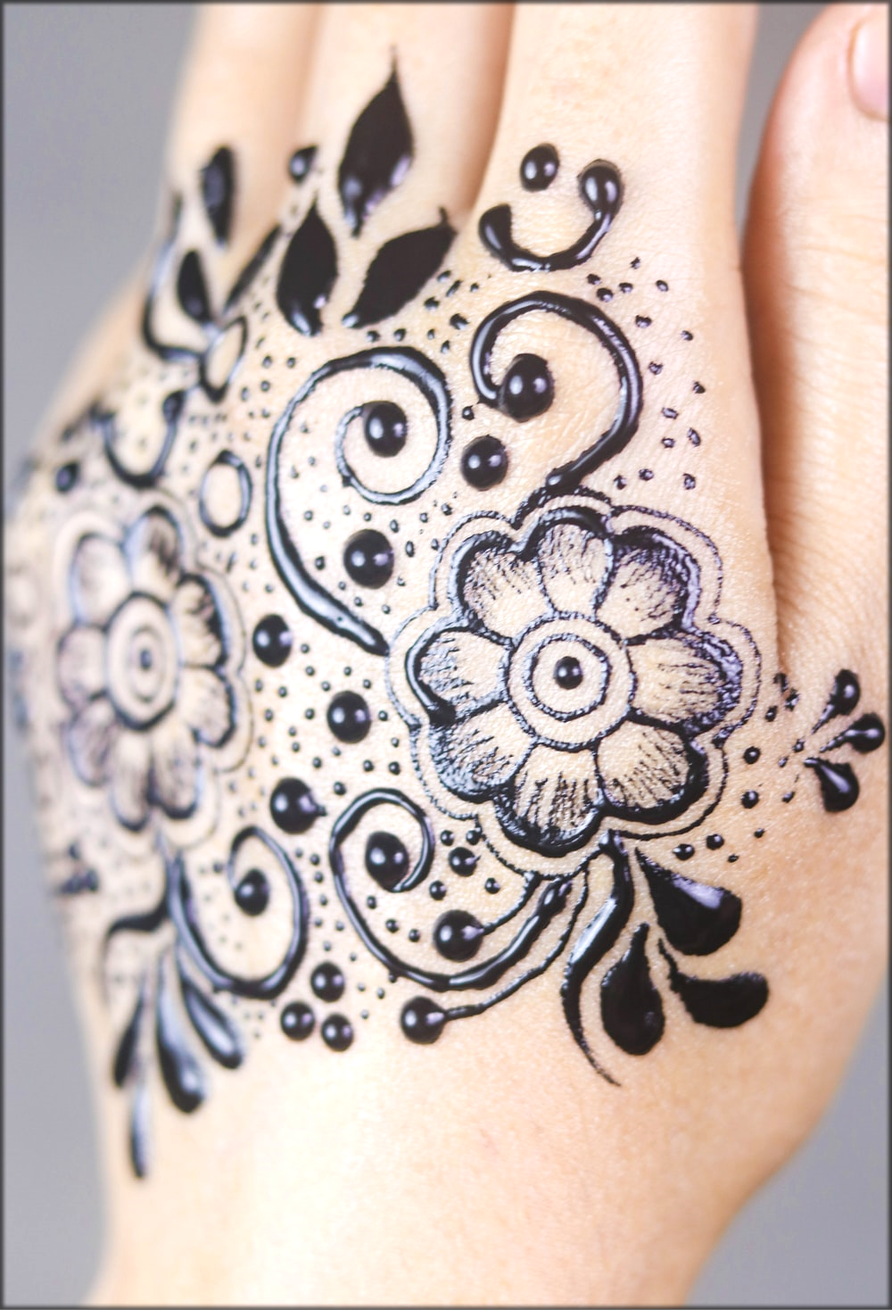 Black Floral Hand Tattoo