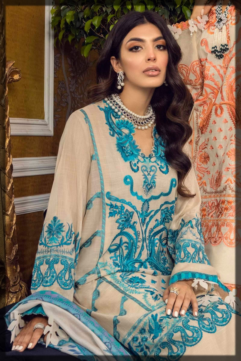 contrasting beige and blue embroidered suit