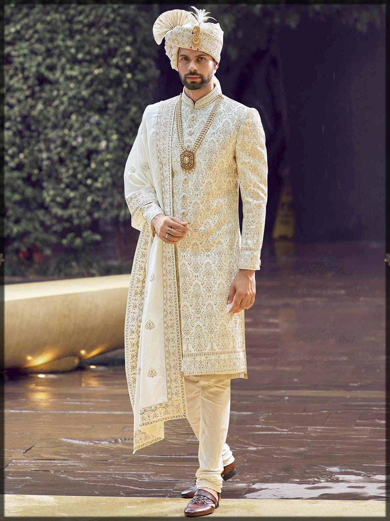 groom in classic white sherwani