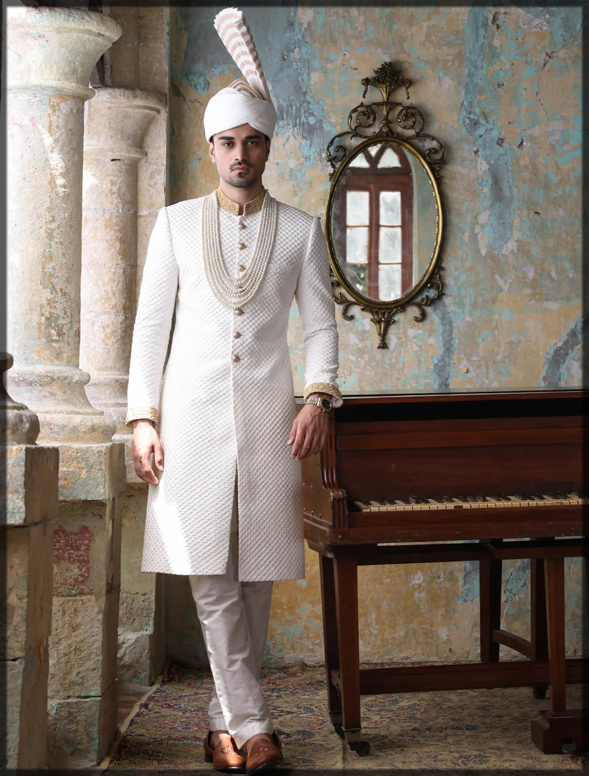 groom in classic white sherwani
