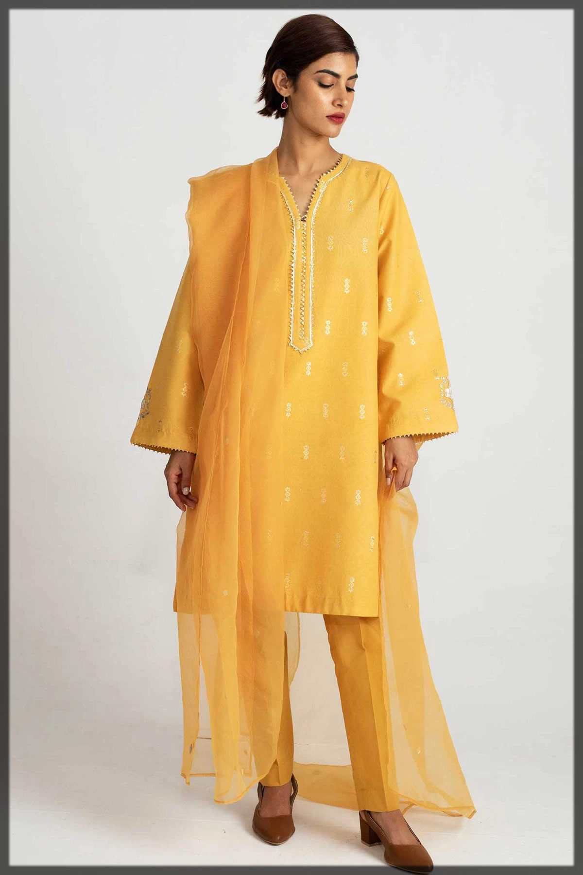 yellow embroidered lawn suit